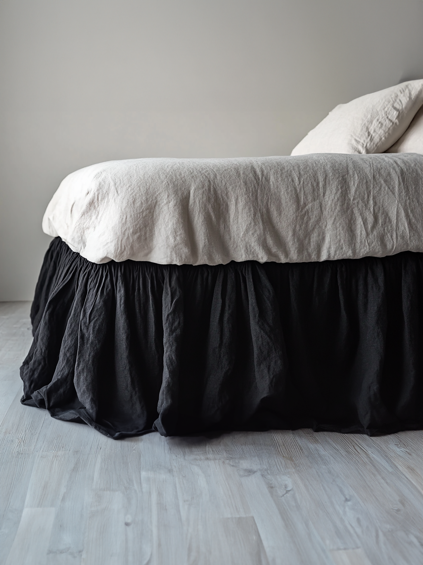 Black ruffled bed skirt