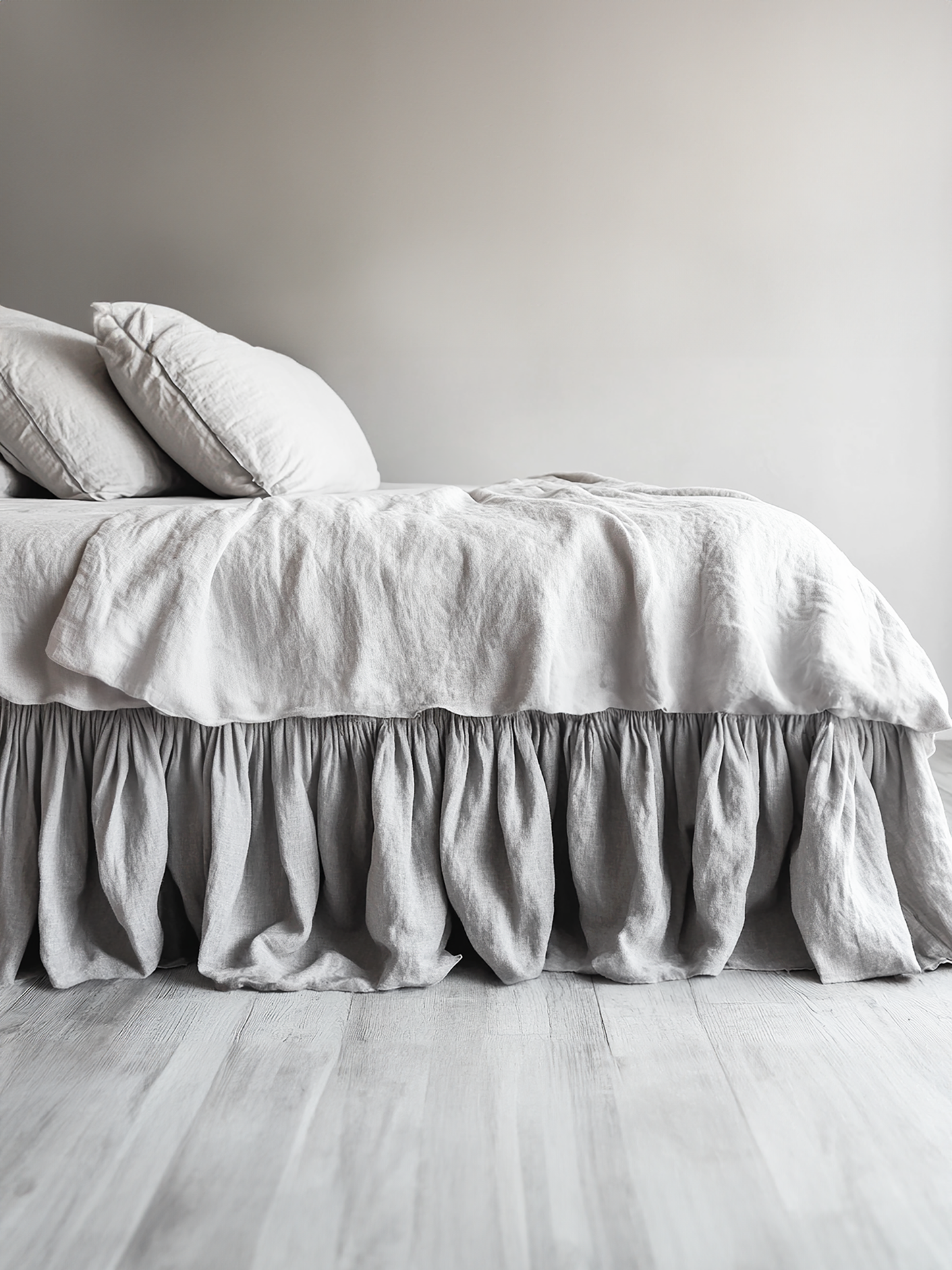 Light gray ruffled bed skirt